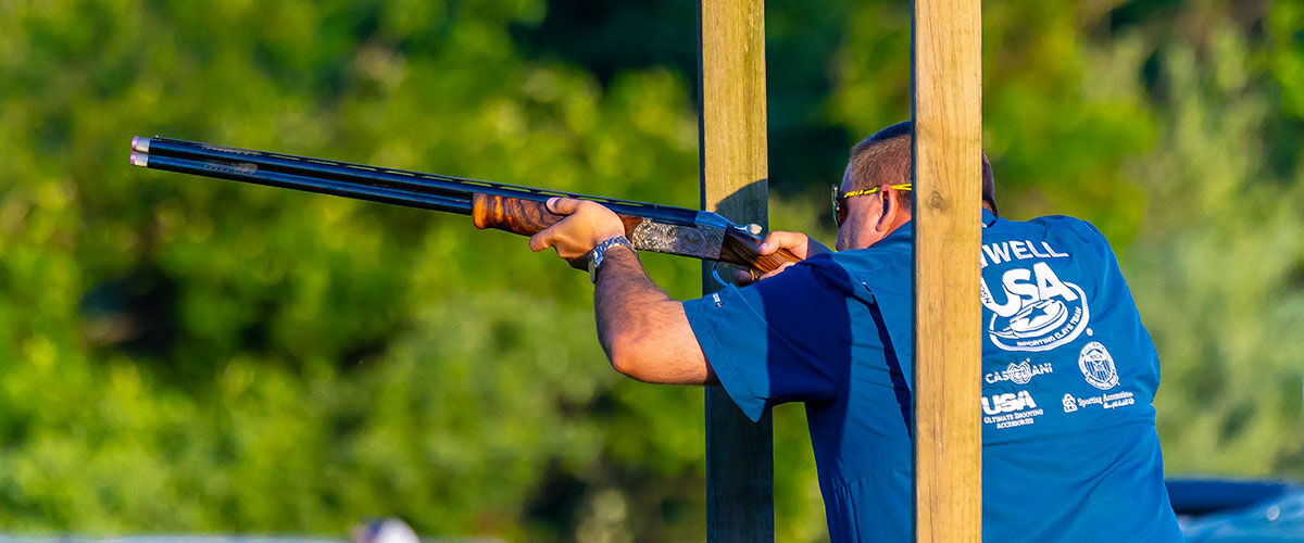 Brandon Powell aiming shotgun